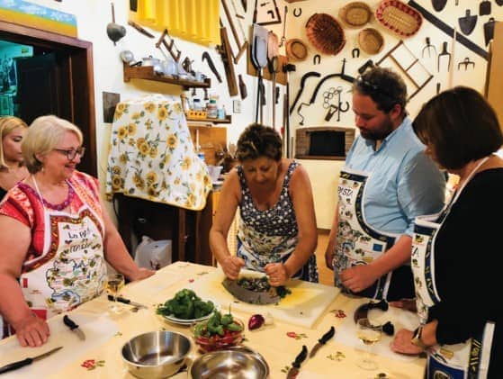 Chopping herbs at an Italian cooking class in a small village outside of Lucca, Italy