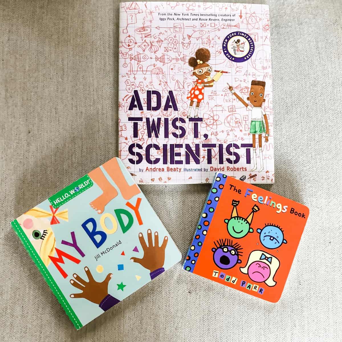 flatlay-of-3-feminist-books-for-boys-ada-twist-scientist-my-body-and-the-feelings-book