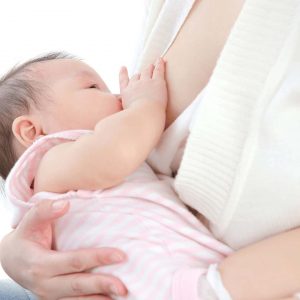mother breastfeeding newborn