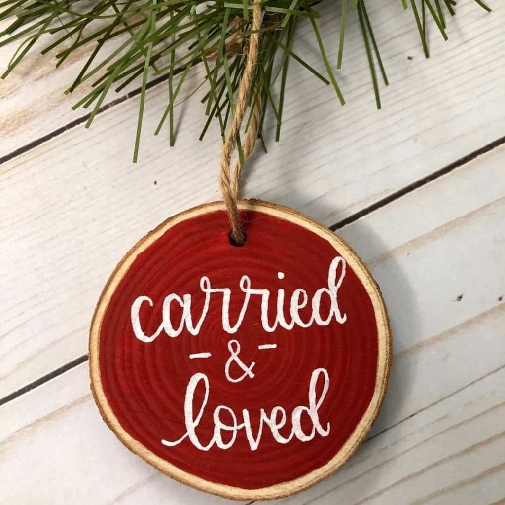 round-wood-ornament-that-says-carried-and-loved-on-front-and-can-be-customized-on-back