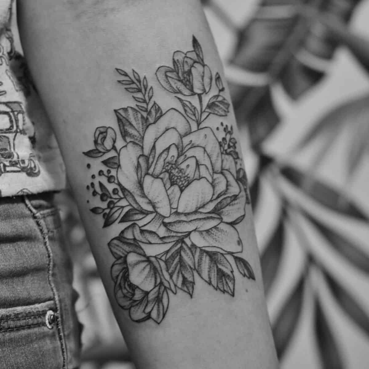 miscarriage tattoo with flowers on arm