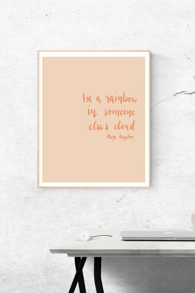 orange wall art print that reads "Be a rainbow in someone else's cloud" a quote by Maya Angelou