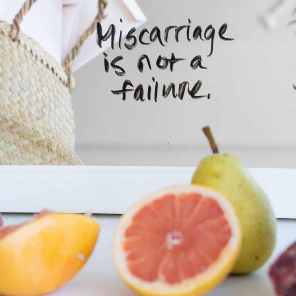 photo of fruit and a basket with text that reads "miscarriage is not a failture."