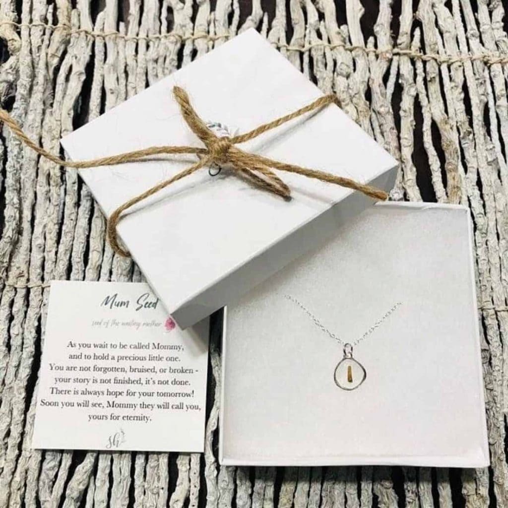 a box that contains a necklace inside