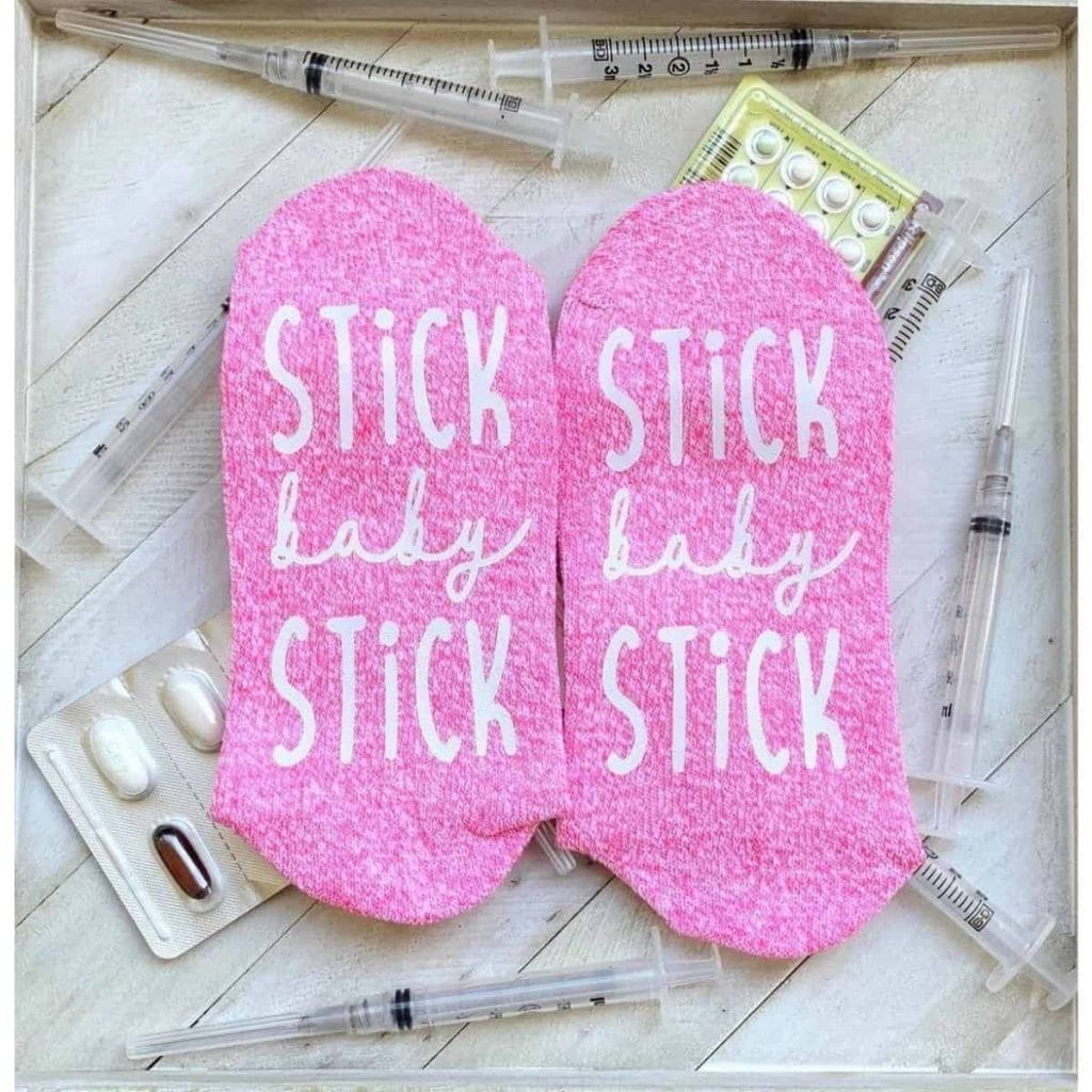 pin socks that read "stick baby stick"