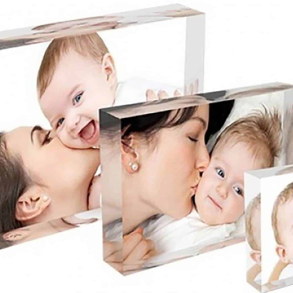 3 acrylic photo blocks with photos of a mom kissing her new baby