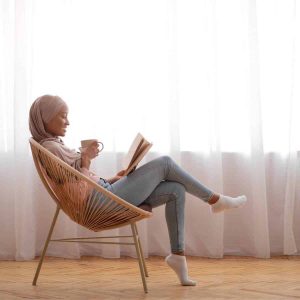Woman reading books about fertility