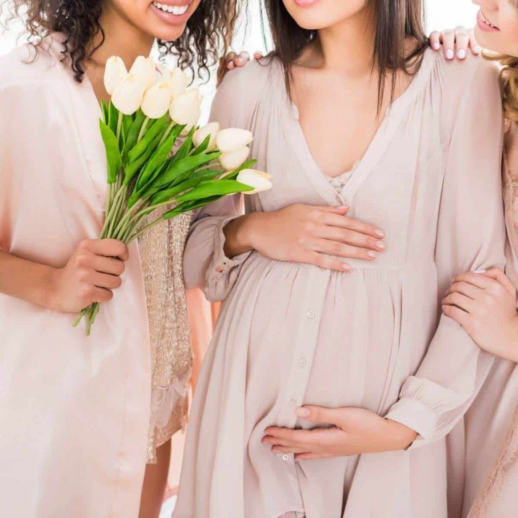Three women in maternity pajamas