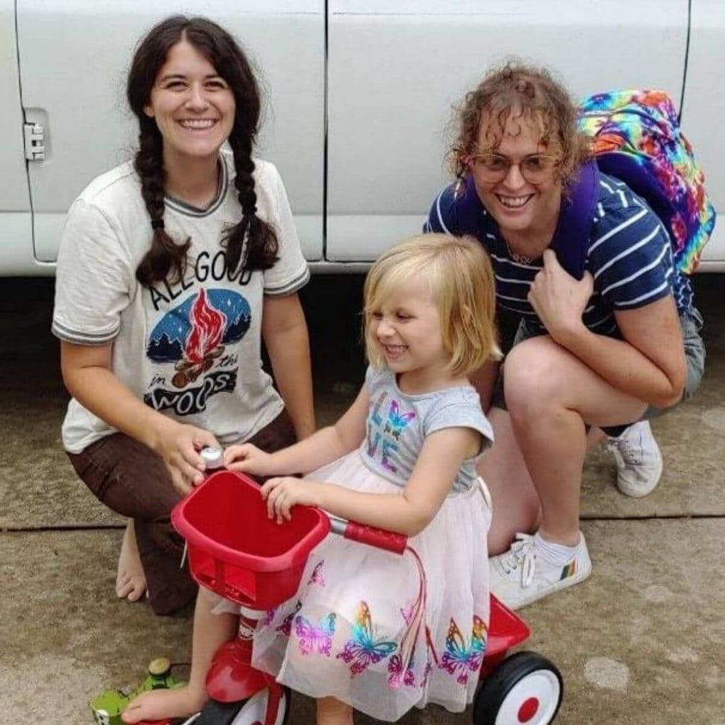 Trans Parenting - Thea, woman, and little girl on tricycle