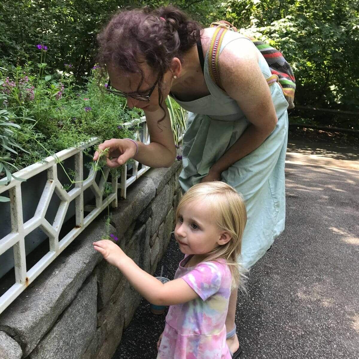 Bonus mom - Thea and girl looking at plant
