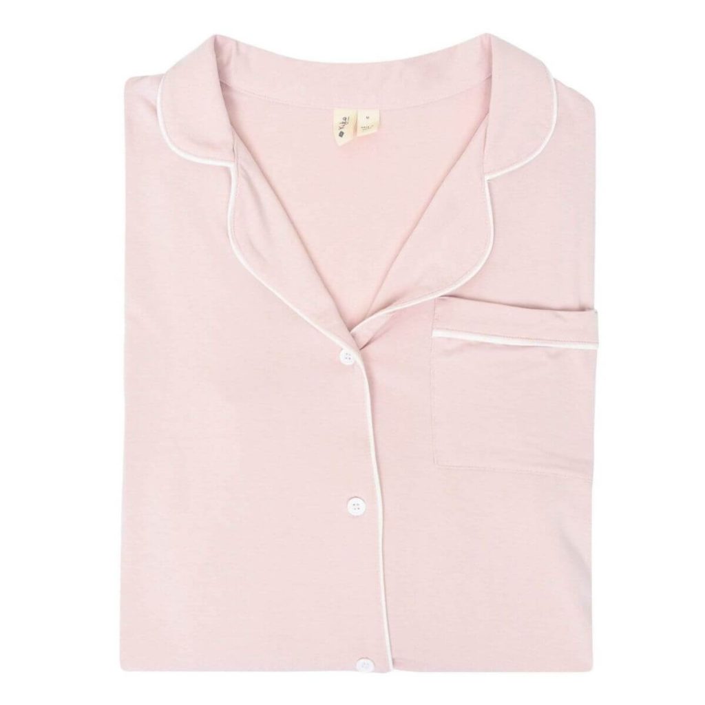 soft pink button-up pajama shirt on white background