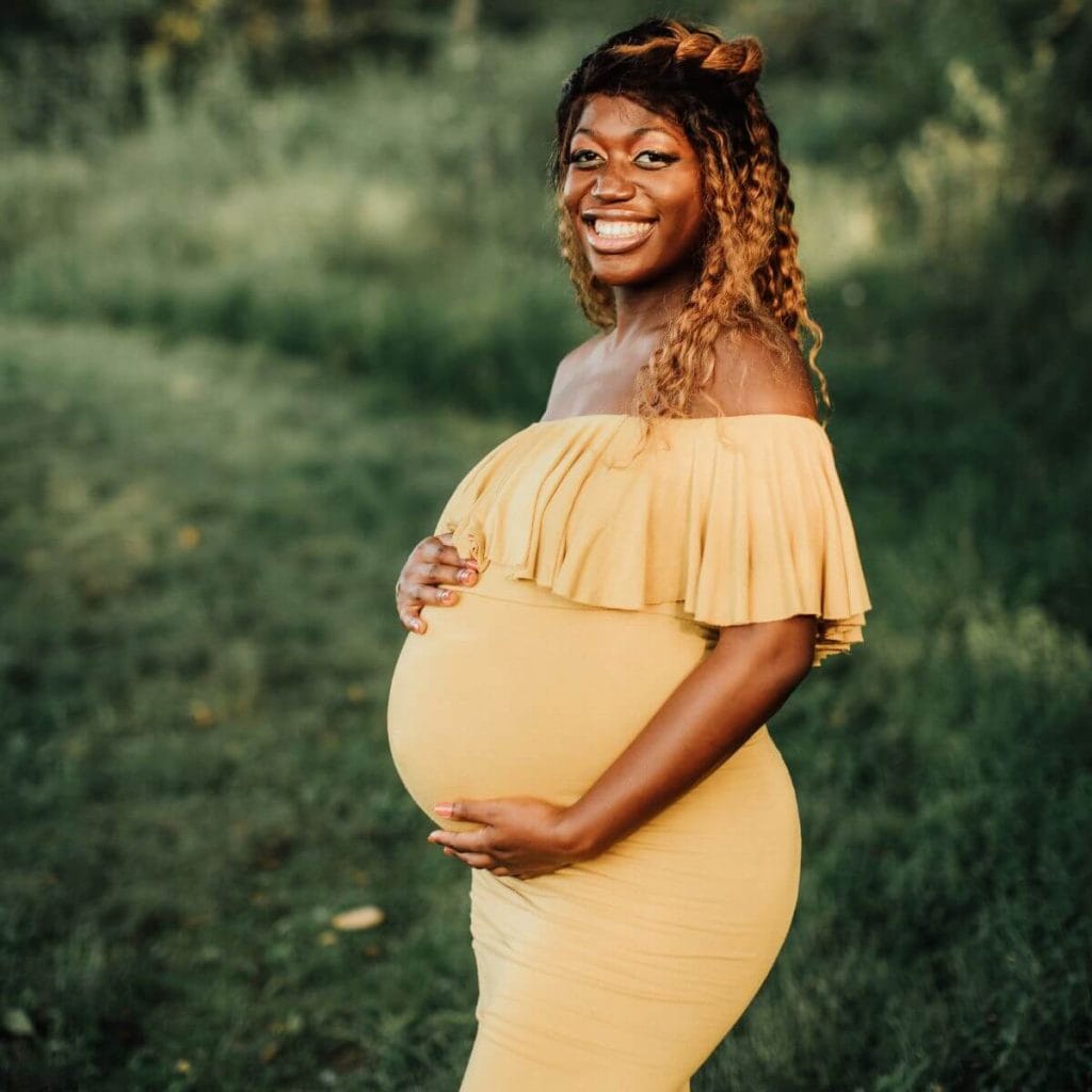 https://undefiningmotherhood.com/wp-content/uploads/2022/10/maternity-shoot-outfits-BIPOC-woman-in-yellow-off-shoulder-dress-1-1024x1024.jpg