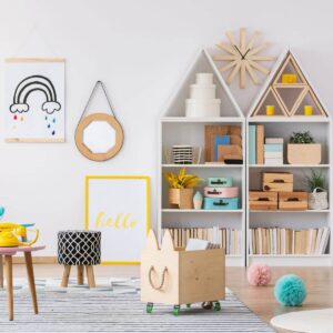 a square image of a precious, colorful playroom. The room has white walls and a natural wood floor with a gray rug. To the left is a small yellow chair, with a wooden bunny-shaped storage bin on the floow. There are two bookshelves in the back of the room with roofs like houses. These shelves hold books, blocks, and beautifully colored items. The room looks like a relaxing, organized haven for young children to play.