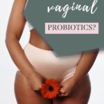 Pin of woman standing in her underwear with a red gerbera daisy held in front of her pelvis. Text reads "Should you take vaginal probiotics?"
