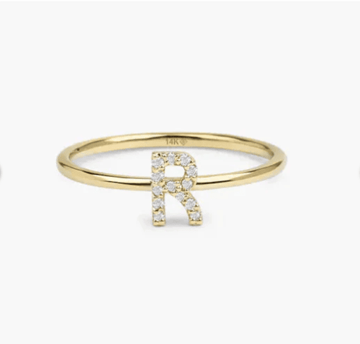 Yellow gold ring with "R" encrusted with pave diamonds